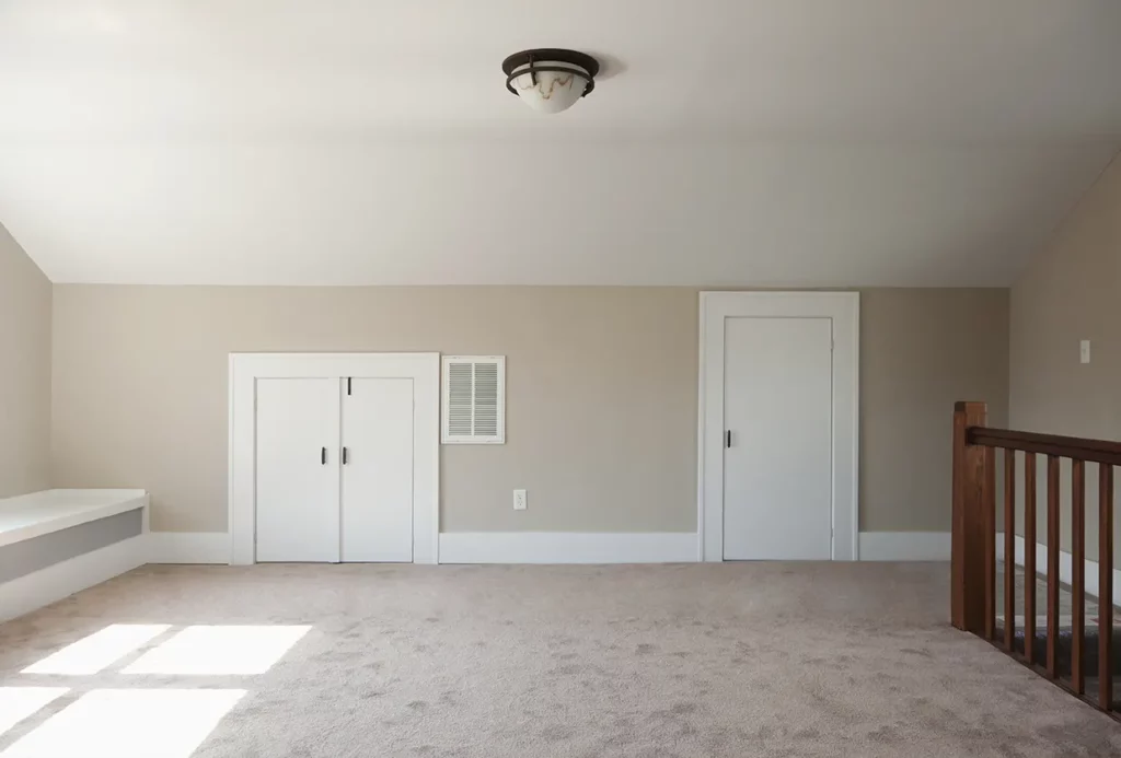 cabinets in an empty room in the attic after renovation