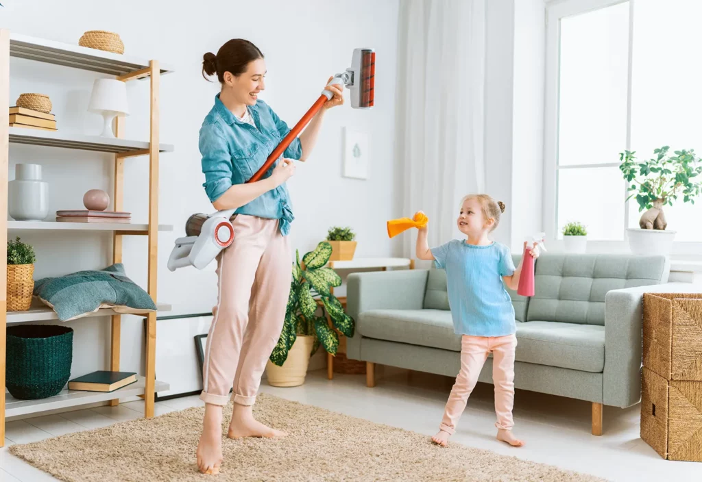 mother and daughter cleaning their new room