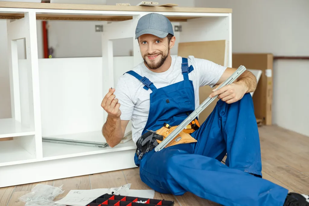 Skilled Coca Construction worker assembling cabinetry during a basement finishing project.