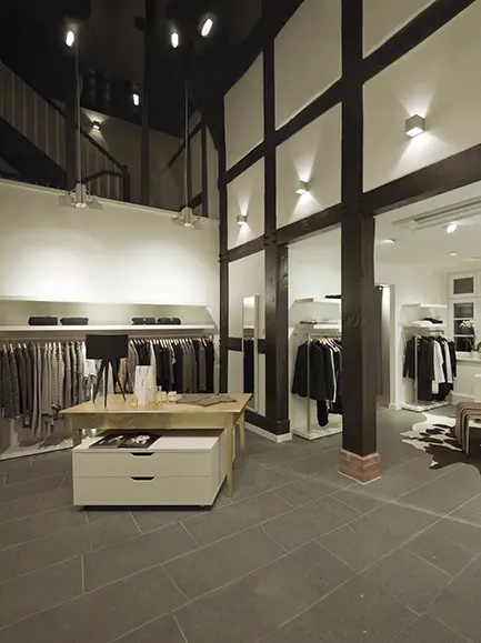 Modern clothing retail store interior with fresh commercial painting by Coca Construction.