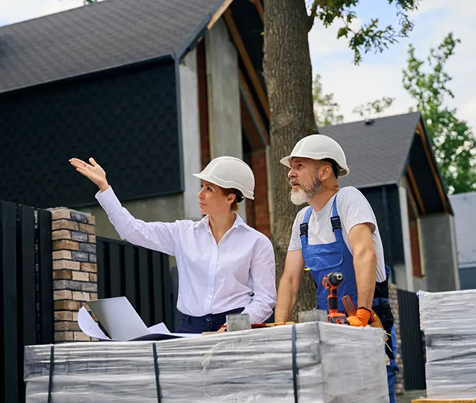 General contractors discussing residential construction project on-site in Spokane